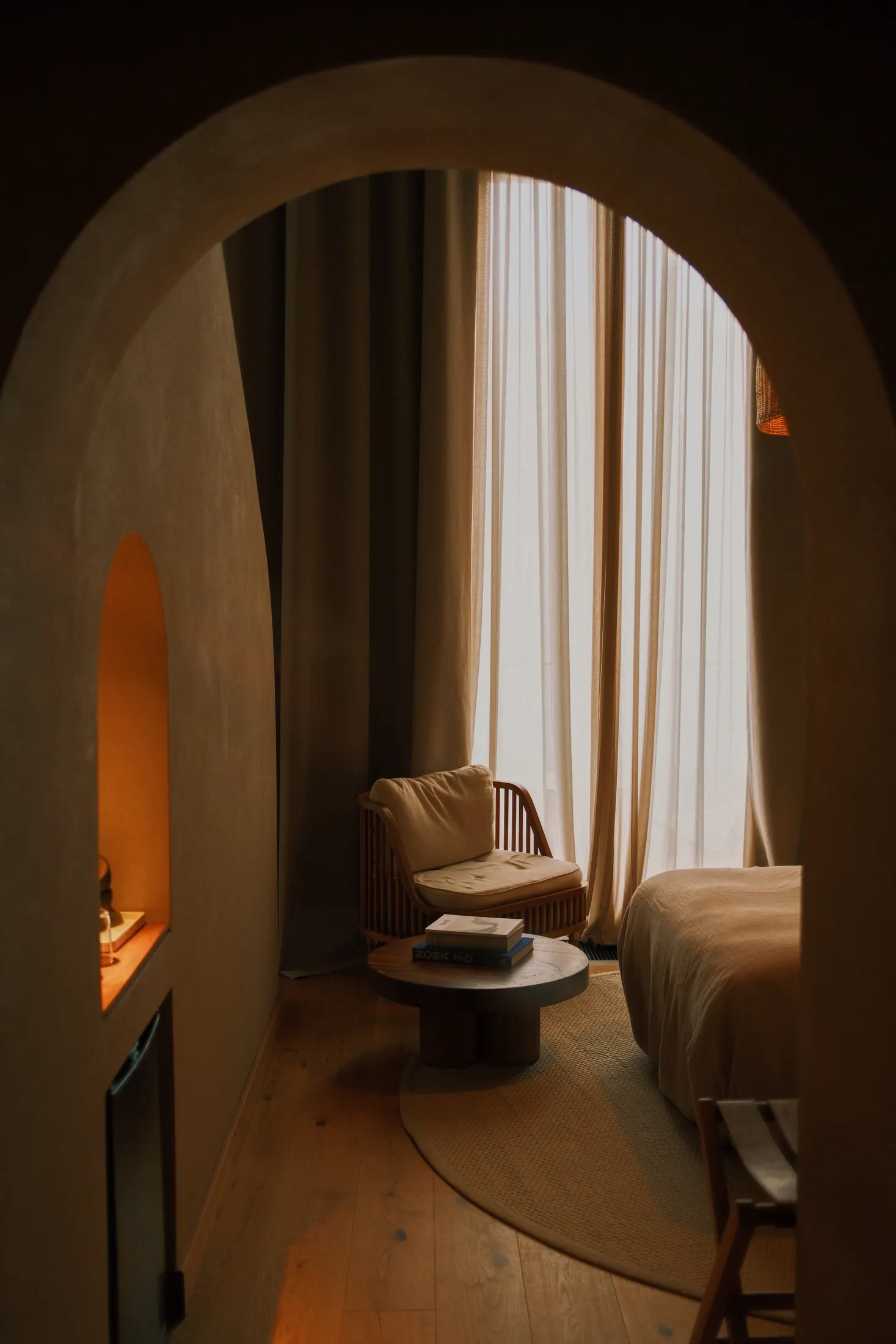 Arched doorway into a sunlit room