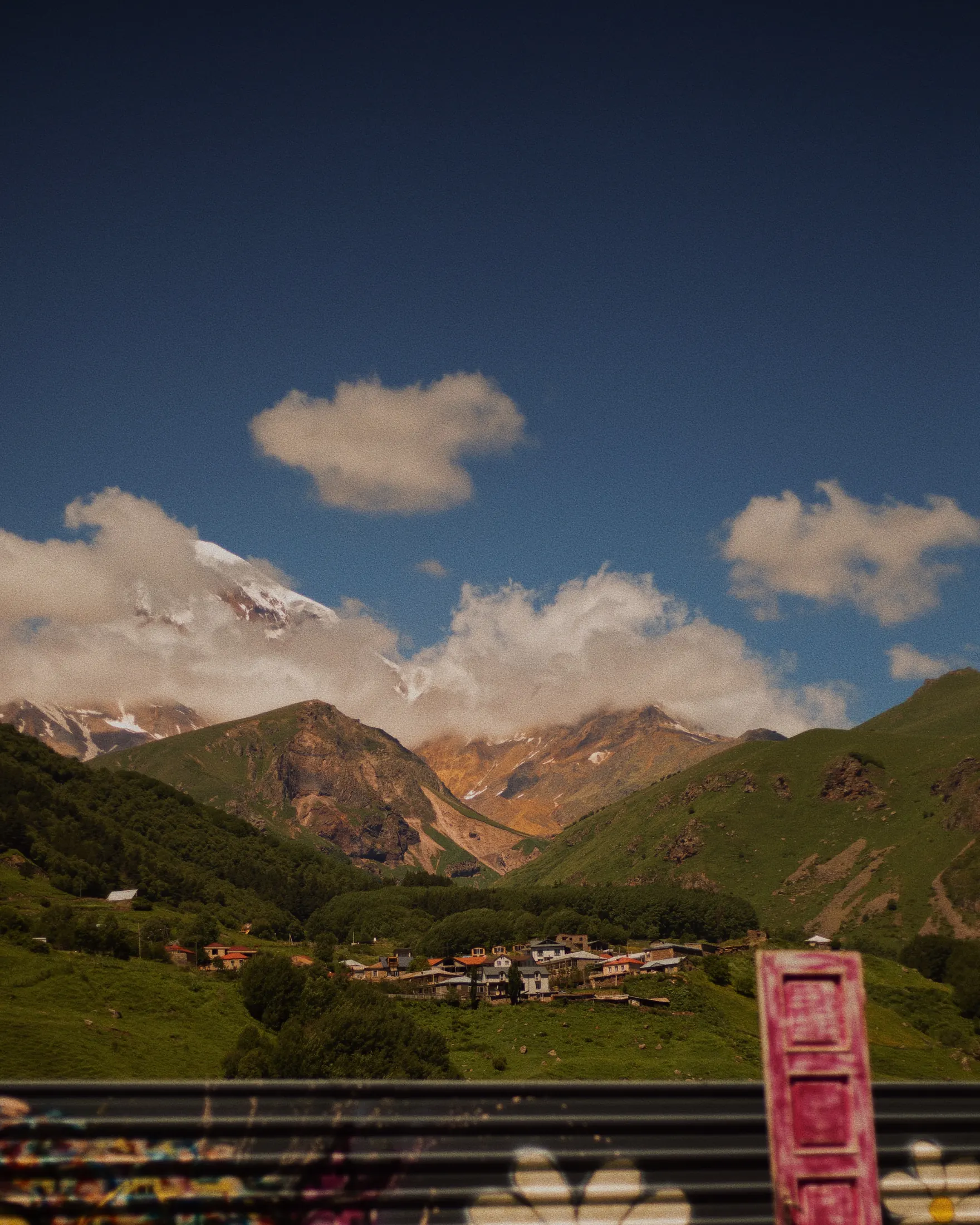 Mountain road beneath open sky